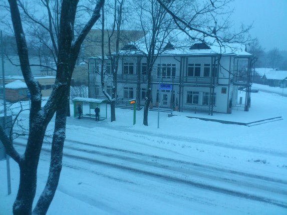 Snowy bus stop in the centre of town, Druskinikai, Lithuania.